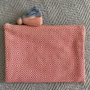 Woven pink and white clutch